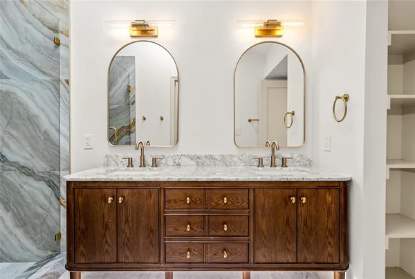 a bathroom with a granite countertop sink a mirror and a