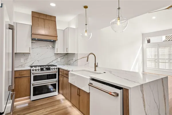 a kitchen with a stove and a sink