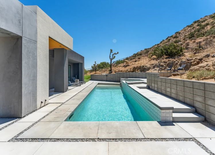 8175 Fox Trail Yucca Valley, CA 92284 - Photo 13 of 75 a view of swimming pool with a outdoor seating