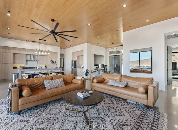 8175 Fox Trail Yucca Valley, CA 92284 - Photo 21 of 75 a living room with furniture and a large window