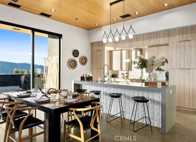 8175 Fox Trail Yucca Valley, CA 92284 - Photo 24 of 75 a kitchen with a table and chairs in it