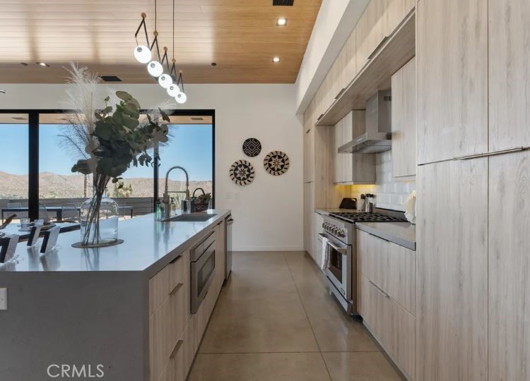 8175 Fox Trail Yucca Valley, CA 92284 - Photo 25 of 75 a kitchen with stainless steel appliances granite countertop a sink a stove and a refrigerator