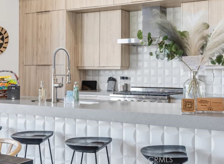 8175 Fox Trail Yucca Valley, CA 92284 - Photo 28 of 75 a kitchen with stainless steel appliances granite countertop a table chairs in it and wooden floor