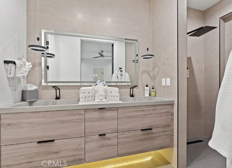 8175 Fox Trail Yucca Valley, CA 92284 - Photo 40 of 75 a bathroom with a granite countertop sink mirror vanity and toilet