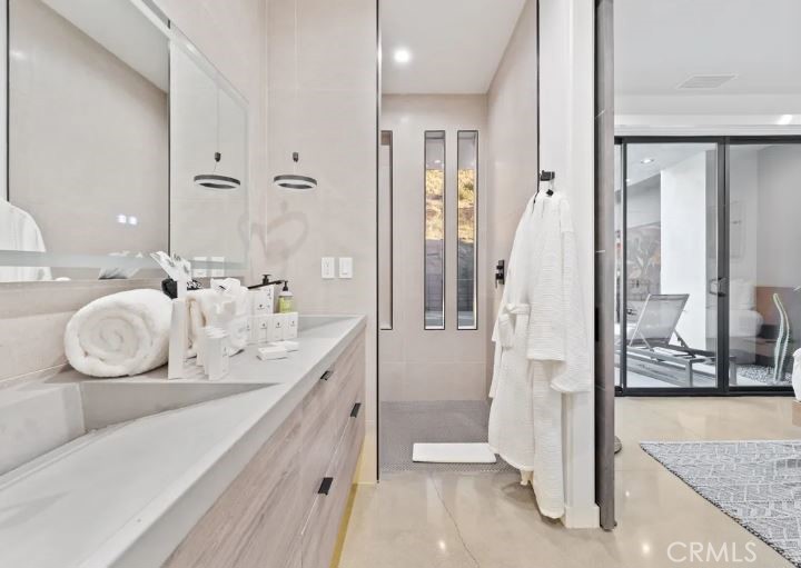 8175 Fox Trail Yucca Valley, CA 92284 - Photo 42 of 75 a bathroom with a double vanity sink and mirror