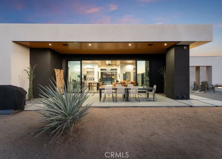 8175 Fox Trail Yucca Valley, CA 92284 - Photo 9 of 75 a view of dining room with furniture and floor to ceiling window