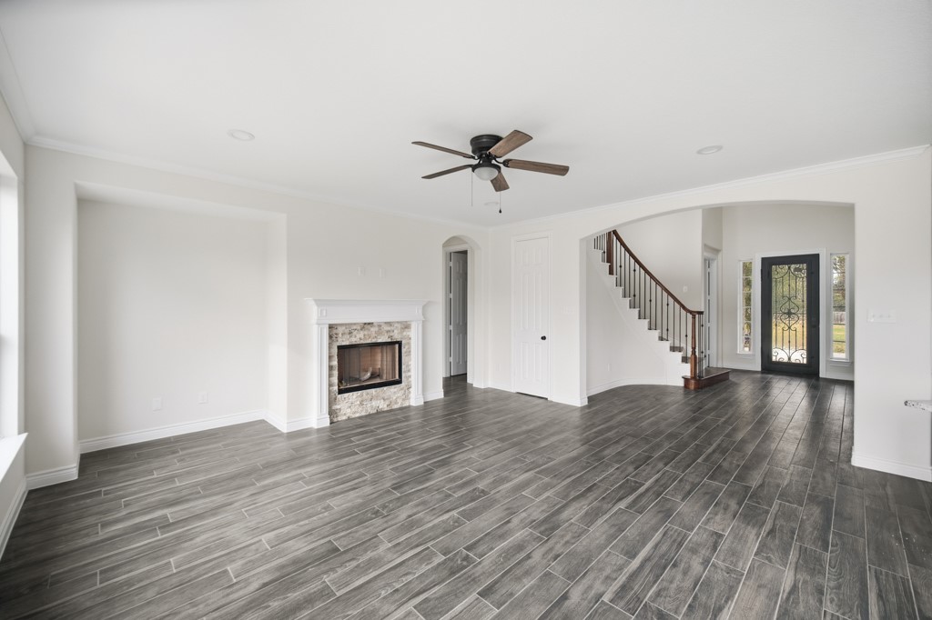 16503 Boston Post Road Cypress, TX 77429 - Photo 12 of 44 a view of a livingroom with wooden floor and a ceiling fan
