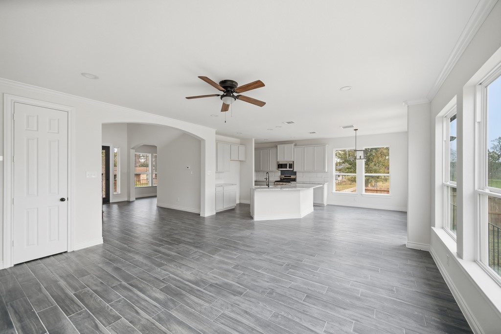 16503 Boston Post Road Cypress, TX 77429 - Photo 13 of 44 a view of an empty room with wooden floor and a window