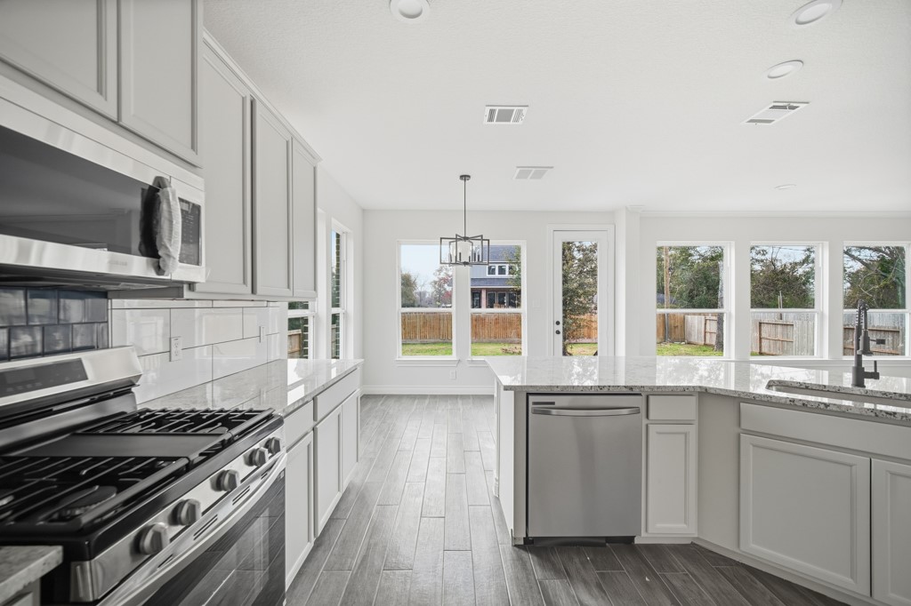 16503 Boston Post Road Cypress, TX 77429 - Photo 16 of 44 The kitchen is equipped with modern stainless steel appliances, combining style and functionality.