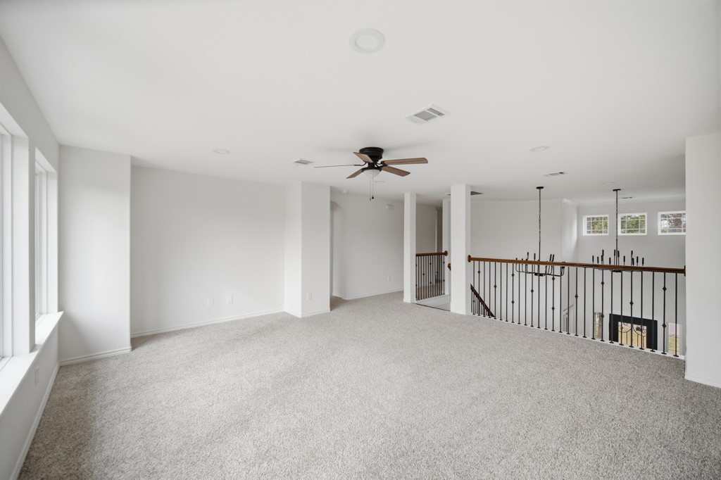 16503 Boston Post Road Cypress, TX 77429 - Photo 27 of 44 a view of a livingroom with a ceiling fan and stairs
