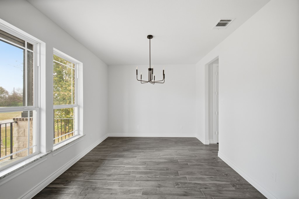 16503 Boston Post Road Cypress, TX 77429 - Photo 7 of 44 a view of empty room with wooden floor and fan
