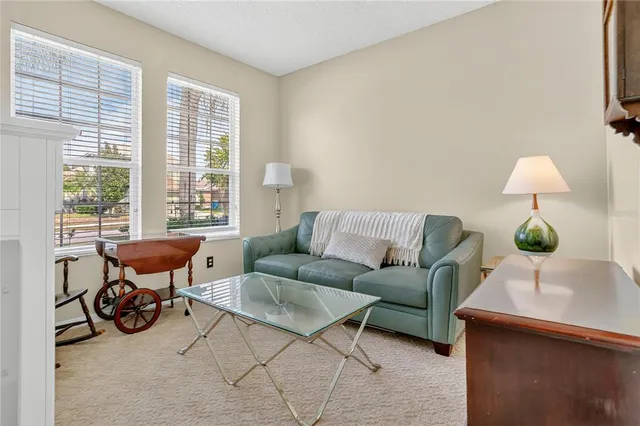 a living room with furniture and a lamp