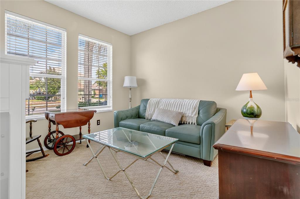 223 Tavestock Loop Winter Springs, FL 32708 - Photo 11 of 27 a living room with furniture and a lamp