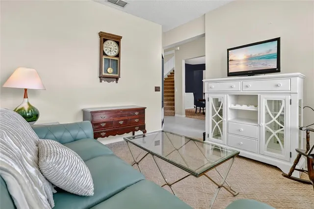 a living room with furniture a lamp and a fireplace