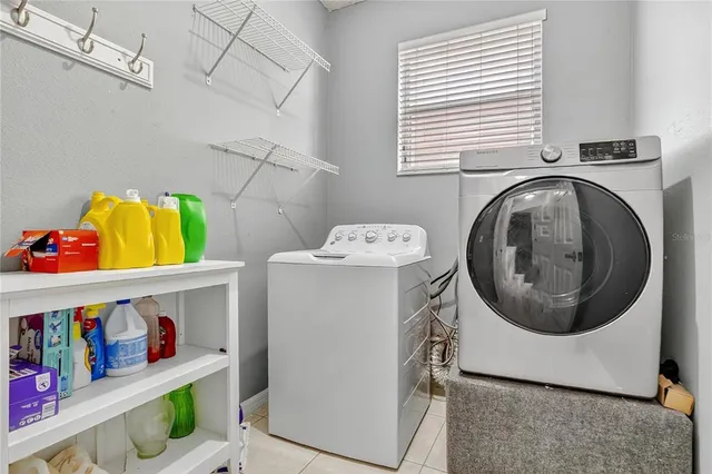a utility room with dryer and washer