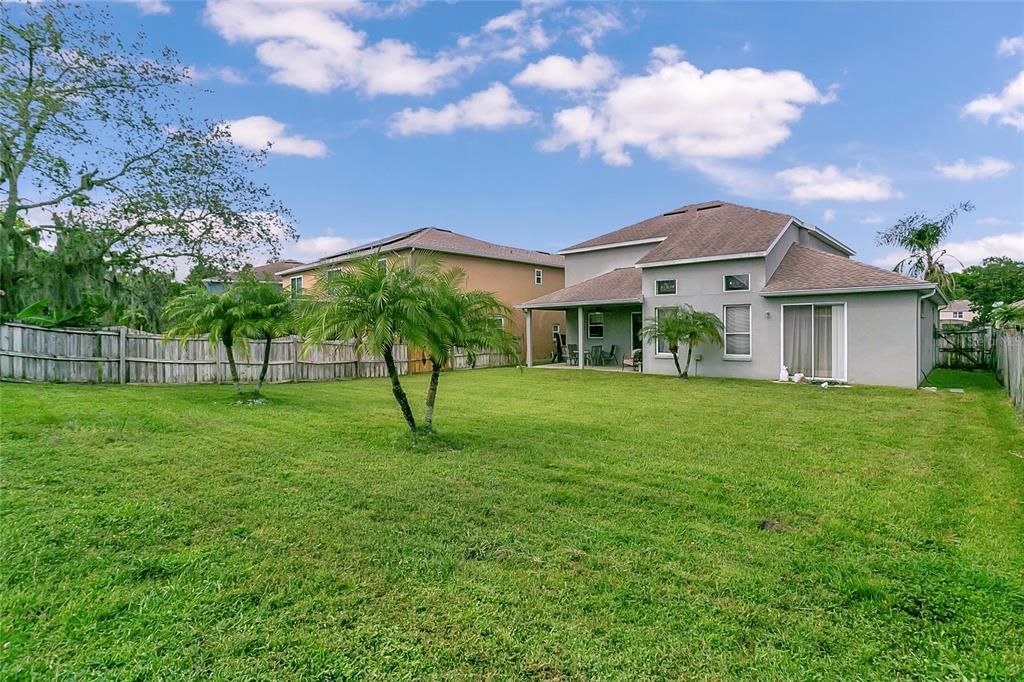 223 Tavestock Loop Winter Springs, FL 32708 - Photo 21 of 27 a view of a house with a yard