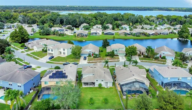 an aerial view of a house with garden space and outdoor seating