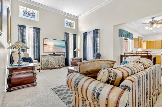 a bedroom with furniture and a chandelier
