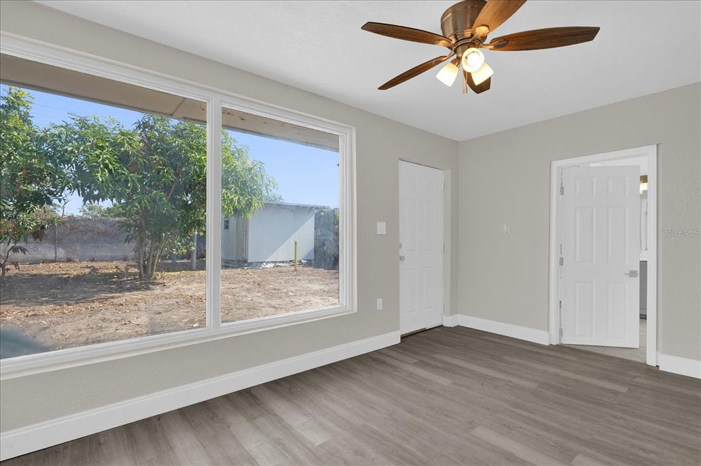 923 Ferndell Road Orlando, FL 32808 - Photo 13 of 42 a view of room with window and ceiling fan
