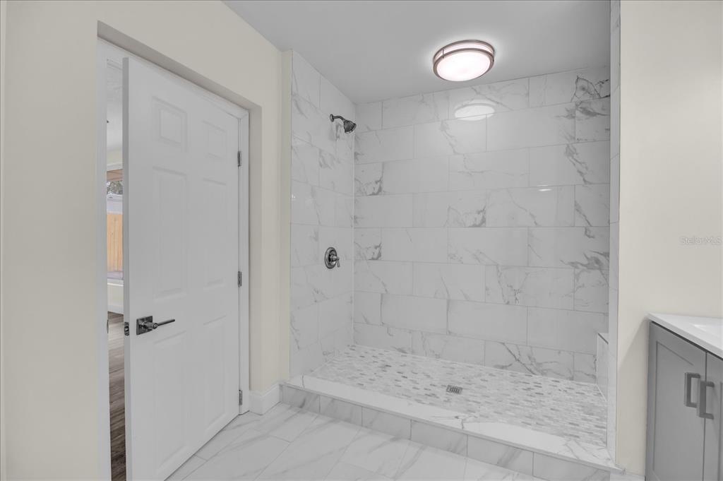 923 Ferndell Road Orlando, FL 32808 - Photo 14 of 42 a bathroom with a shower