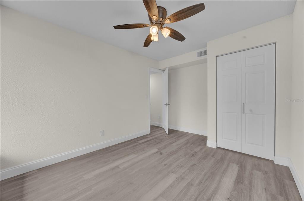 923 Ferndell Road Orlando, FL 32808 - Photo 25 of 42 wooden floor in an empty room