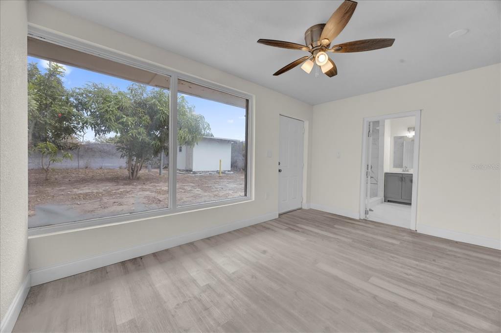 923 Ferndell Road Orlando, FL 32808 - Photo 27 of 42 a view of an empty room with a window