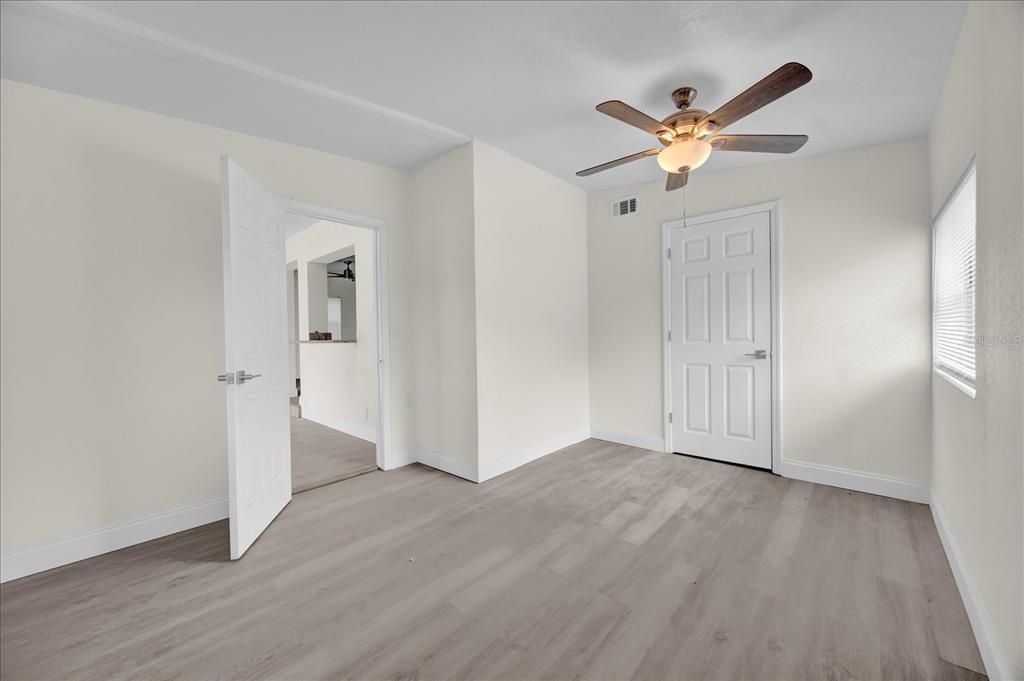 923 Ferndell Road Orlando, FL 32808 - Photo 34 of 42 a view of empty room with wooden floor