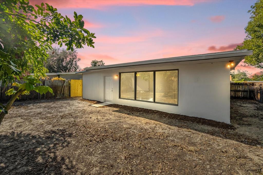 923 Ferndell Road Orlando, FL 32808 - Photo 38 of 42 a view of a house with a backyard