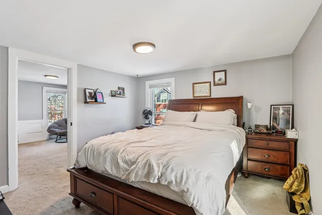 a bedroom with a bed and a tv