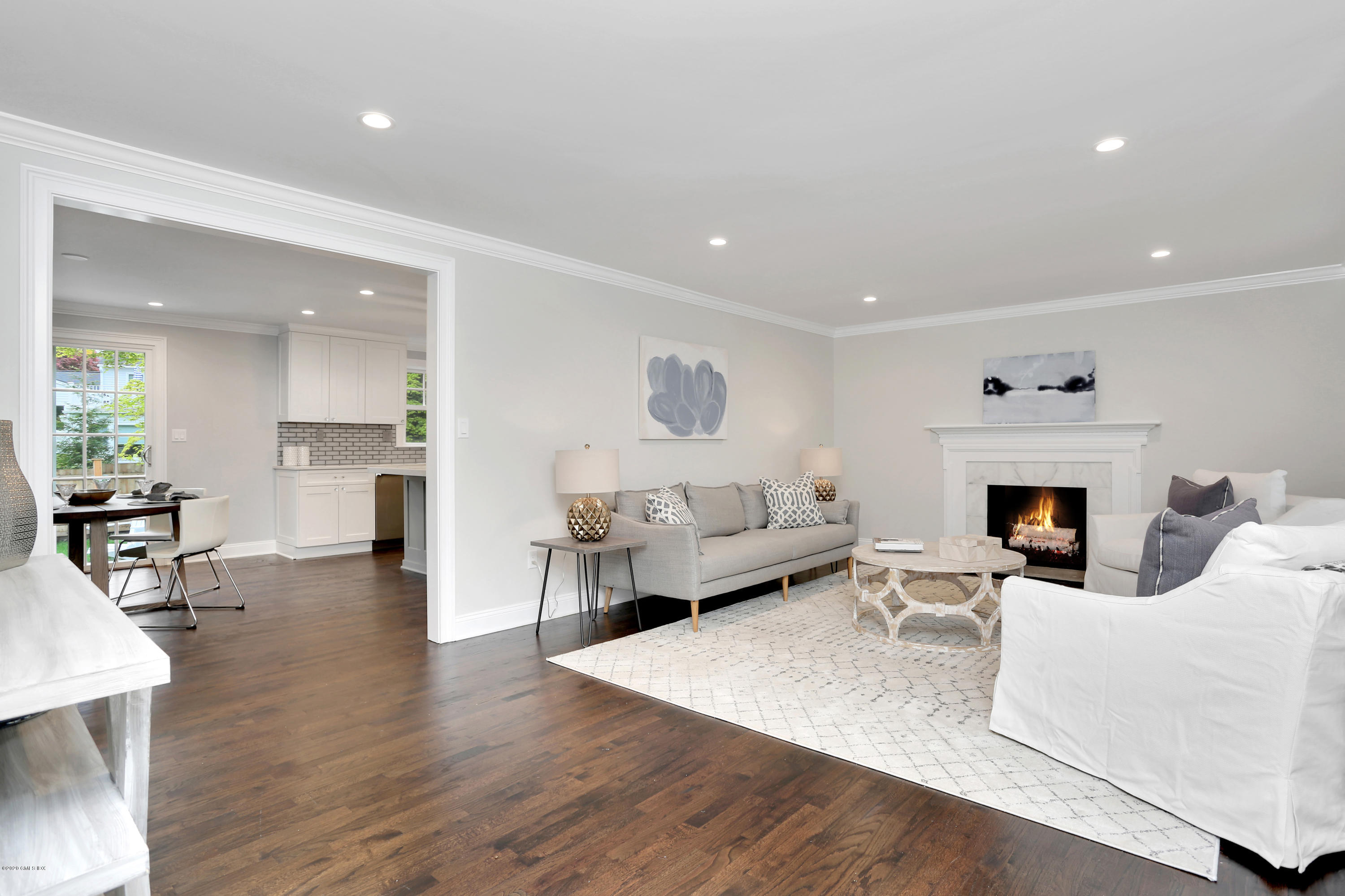 183 North Maple Avenue Greenwich, CT 06830 - Photo 11 of 26 a living room with furniture and a fireplace