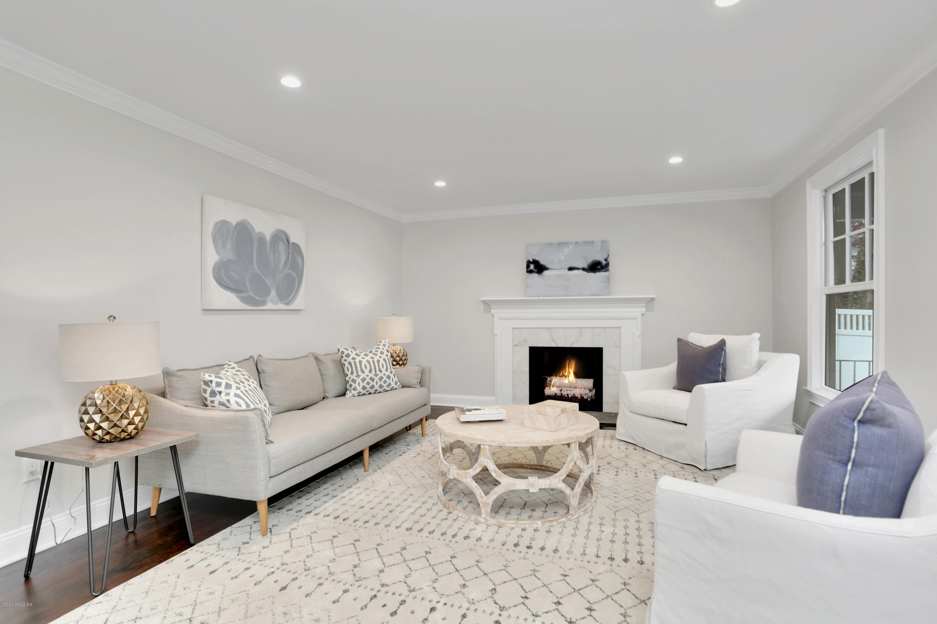 183 North Maple Avenue Greenwich, CT 06830 - Photo 12 of 26 a living room with furniture and a fireplace
