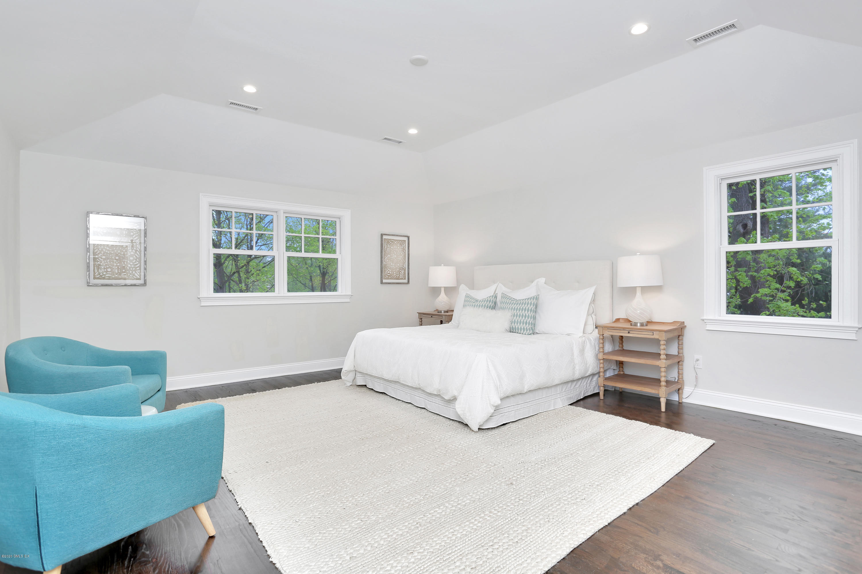 183 North Maple Avenue Greenwich, CT 06830 - Photo 15 of 26 a bedroom with a large bed and a window