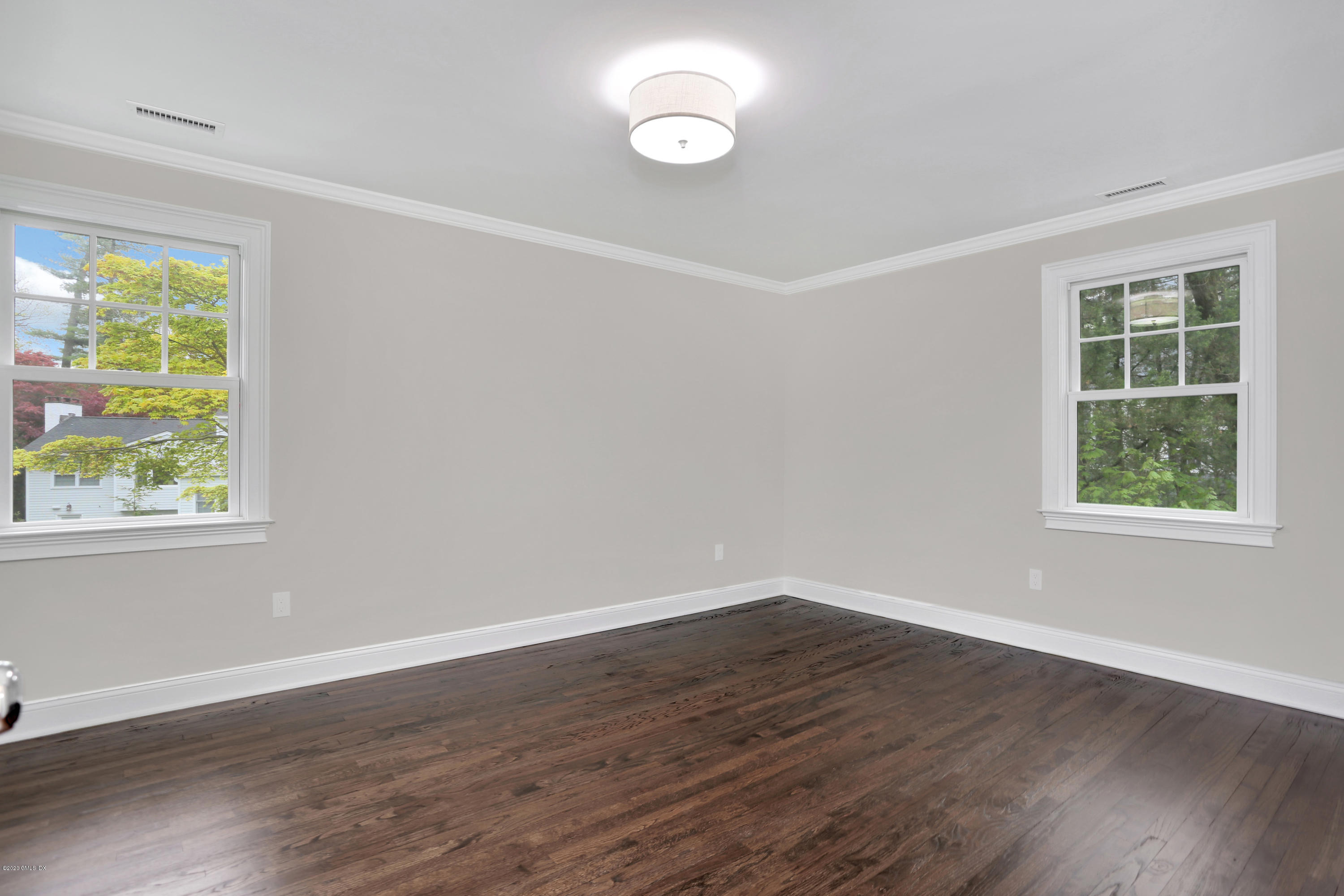 183 North Maple Avenue Greenwich, CT 06830 - Photo 18 of 26 a view of a room that has wooden floor and windows