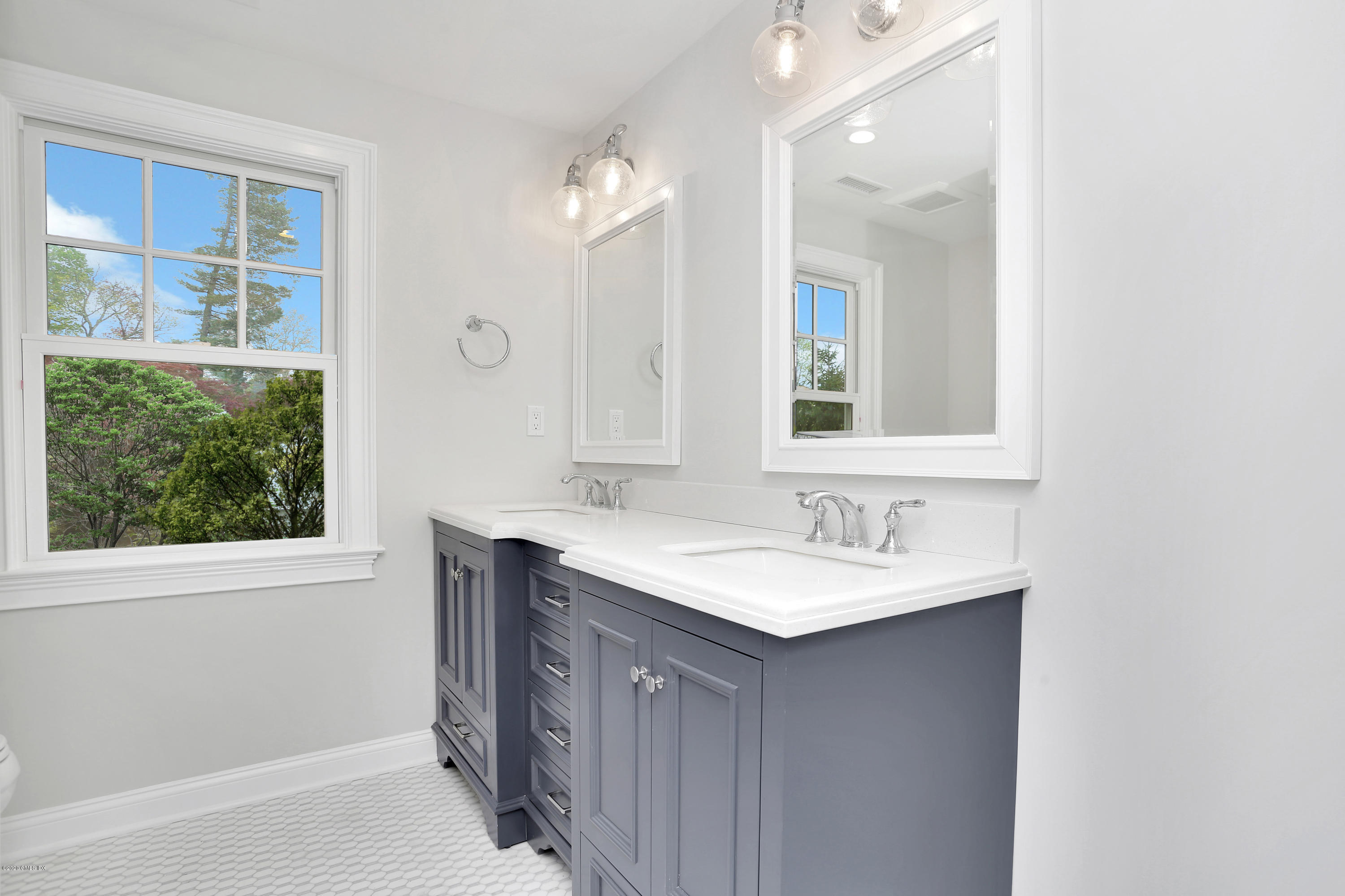 183 North Maple Avenue Greenwich, CT 06830 - Photo 19 of 26 a bathroom with a sink and a mirror