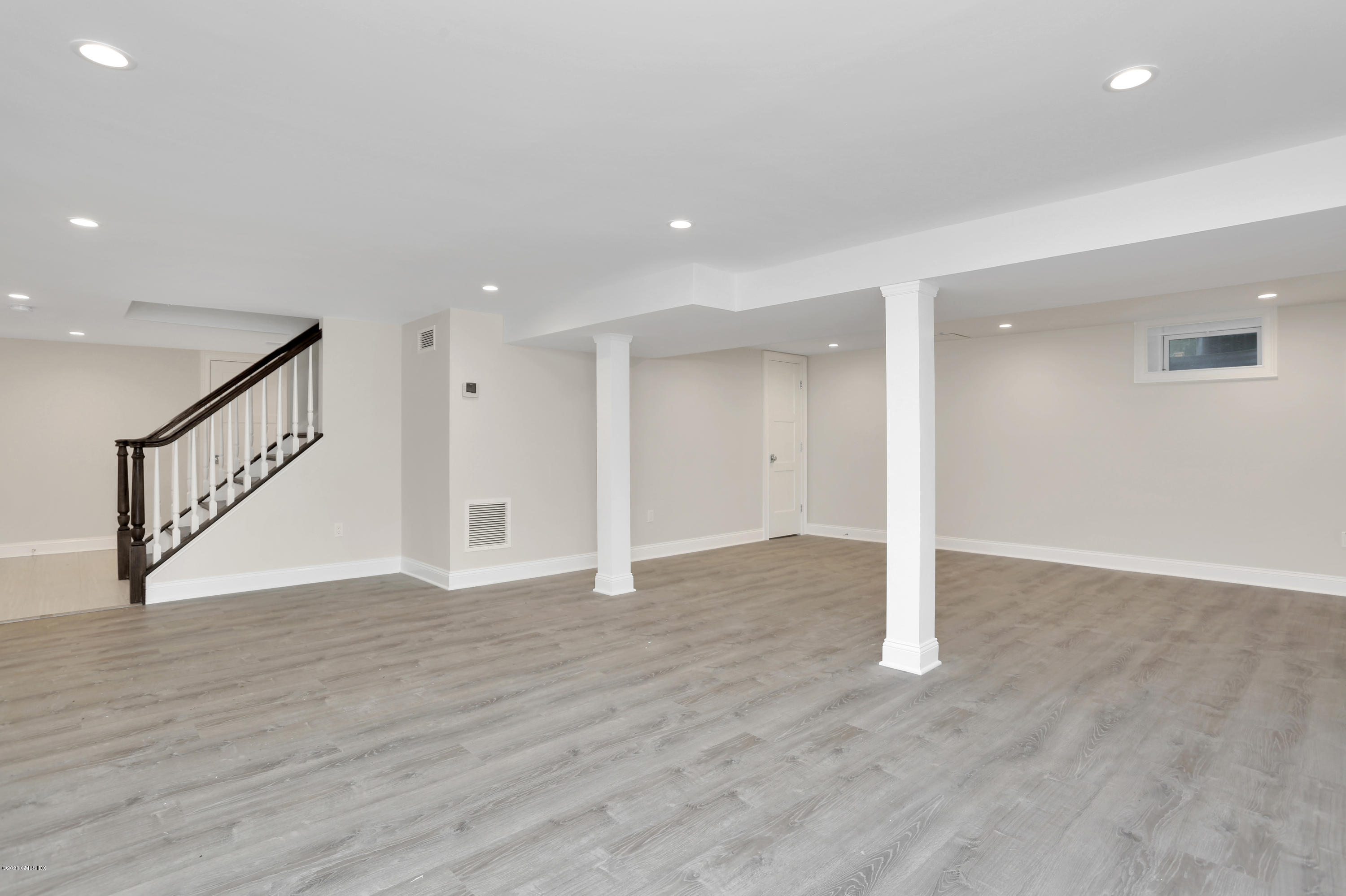 183 North Maple Avenue Greenwich, CT 06830 - Photo 21 of 26 a view of an empty room with wooden floor