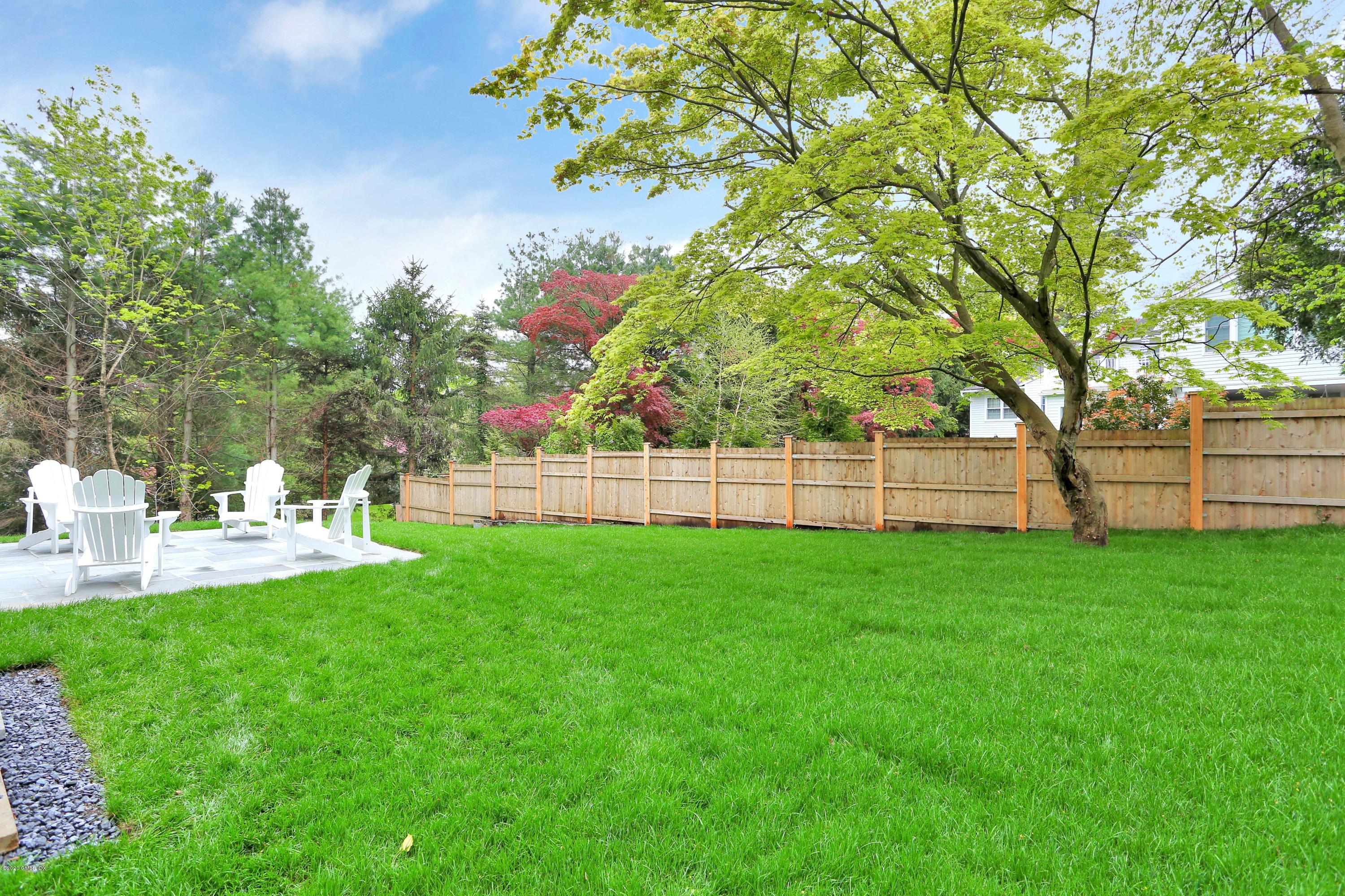 183 North Maple Avenue Greenwich, CT 06830 - Photo 23 of 26 a view of a chair and table of the garden