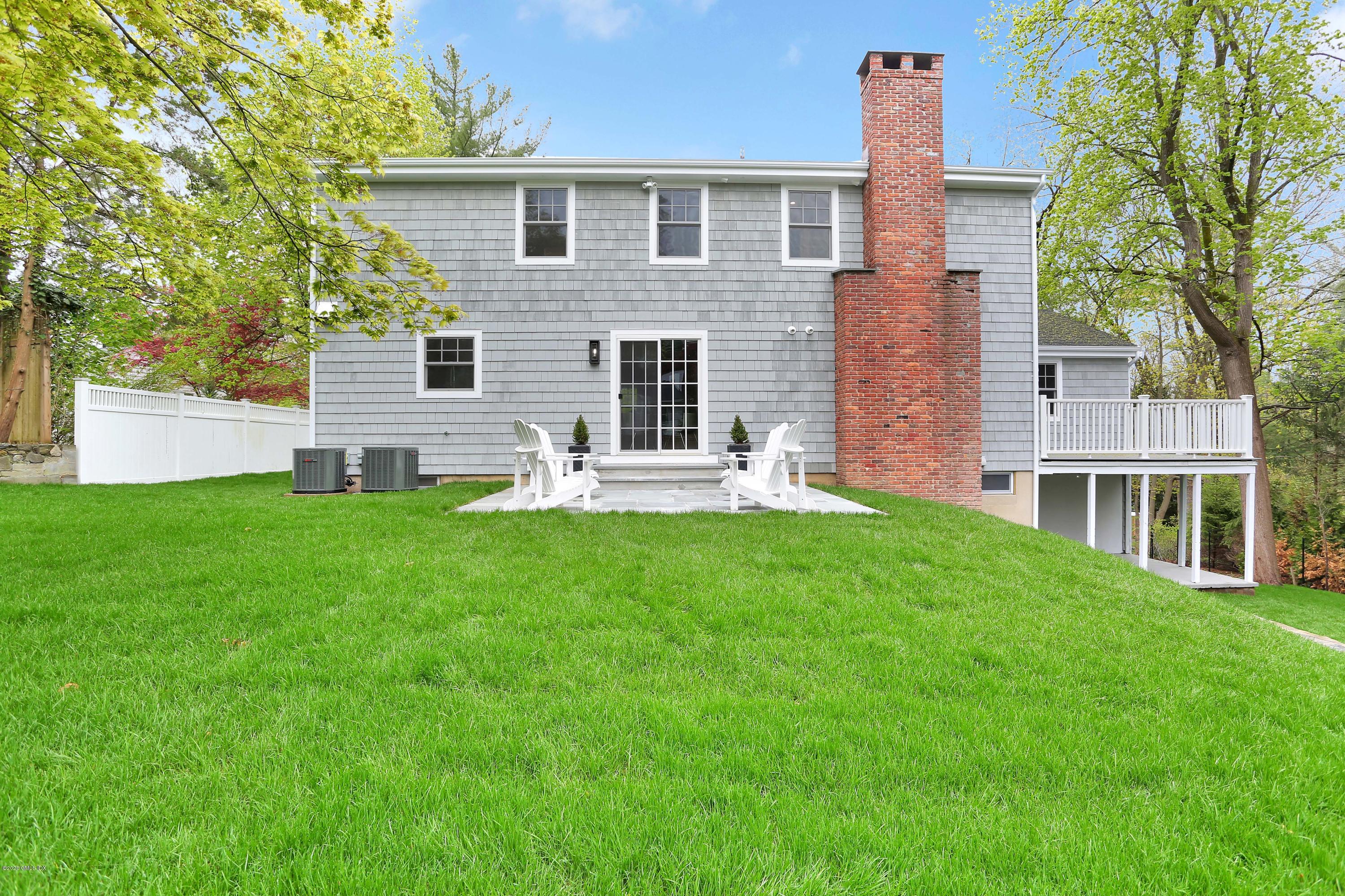 183 North Maple Avenue Greenwich, CT 06830 - Photo 24 of 26 a front view of house with yard and green space