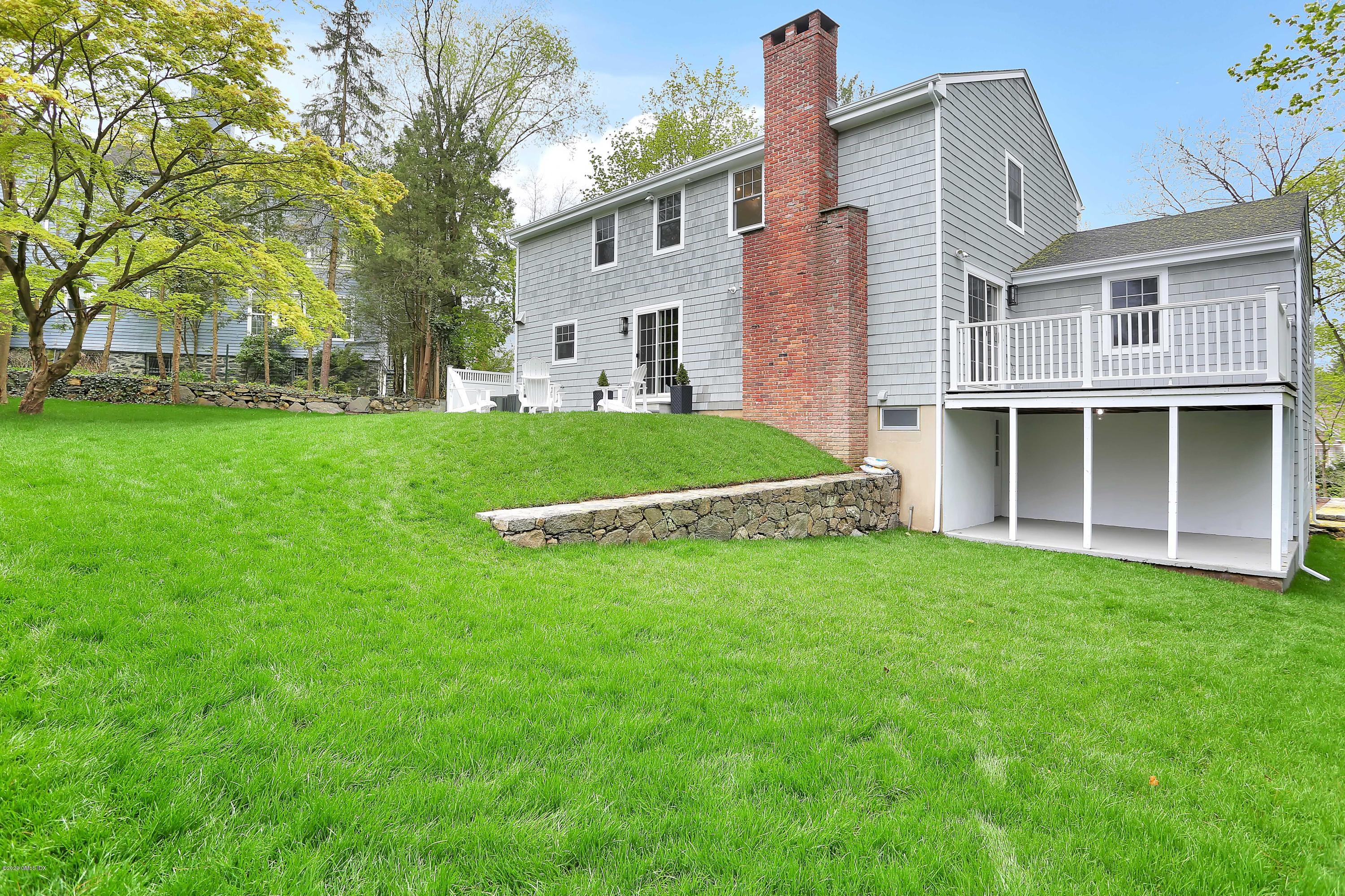 183 North Maple Avenue Greenwich, CT 06830 - Photo 25 of 26 a view of a house with a backyard