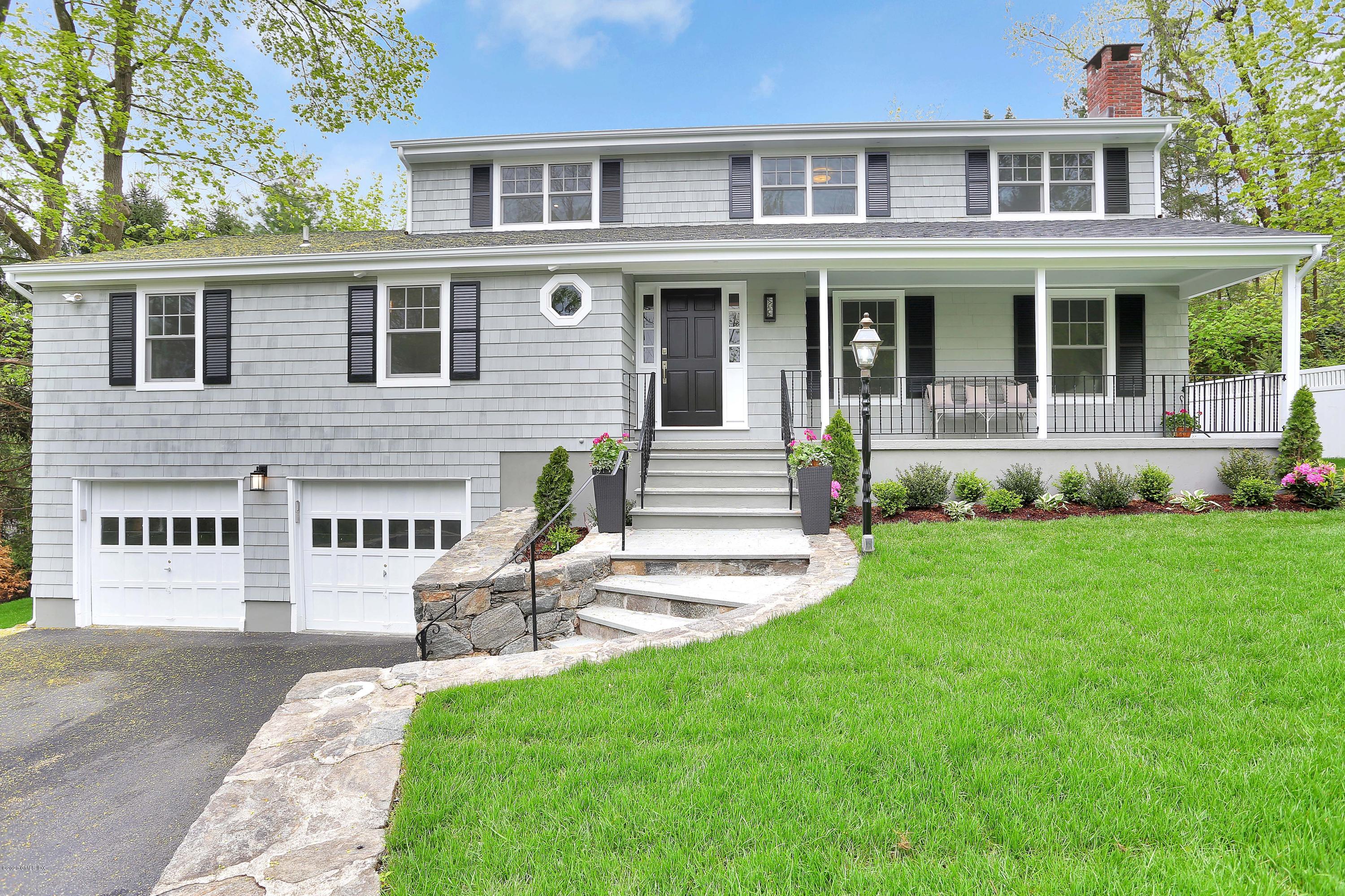 183 North Maple Avenue Greenwich, CT 06830 - Photo 26 of 26 a front view of a house with a yard table and chairs