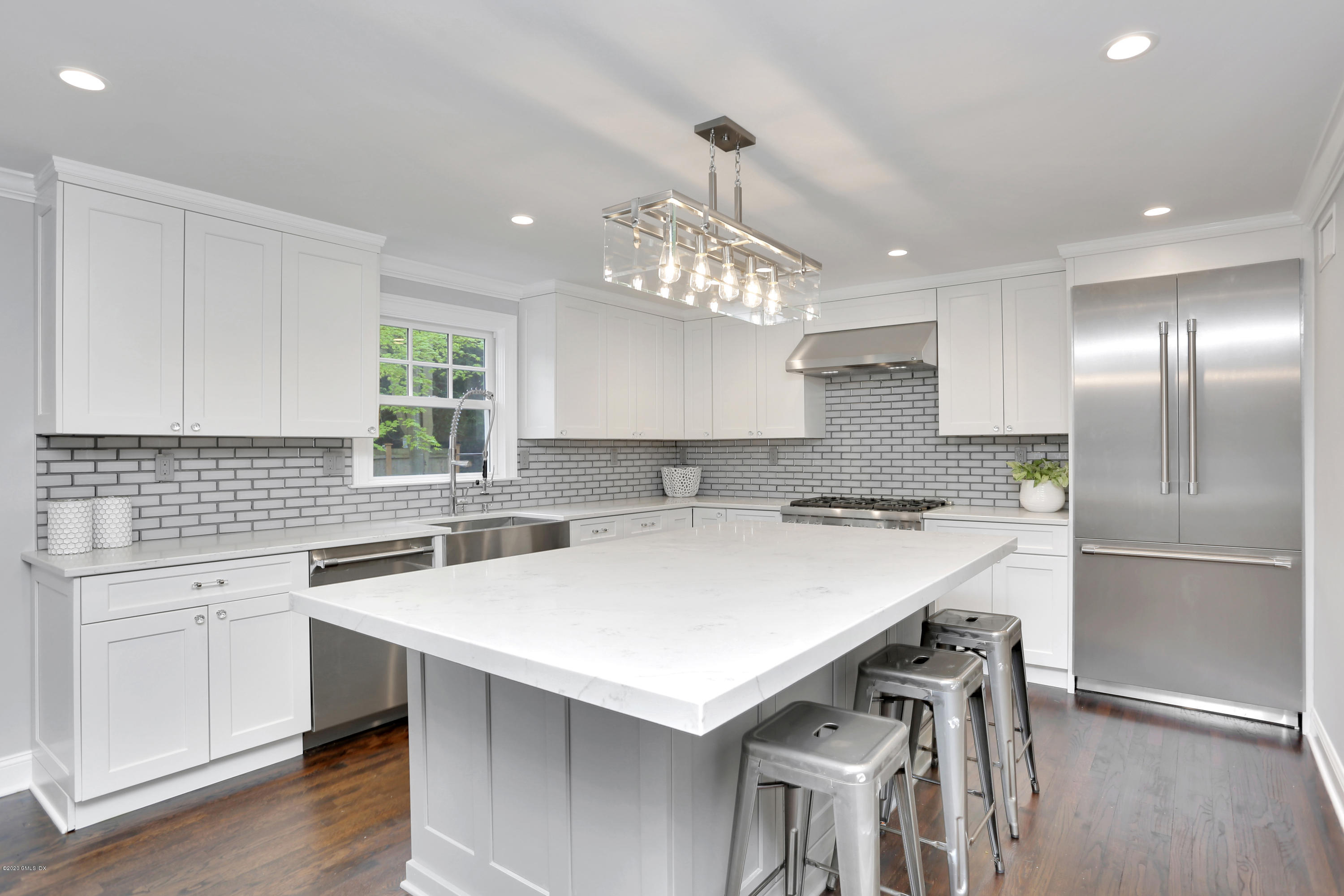 183 North Maple Avenue Greenwich, CT 06830 - Photo 4 of 26 a kitchen with a stove a sink and a refrigerator
