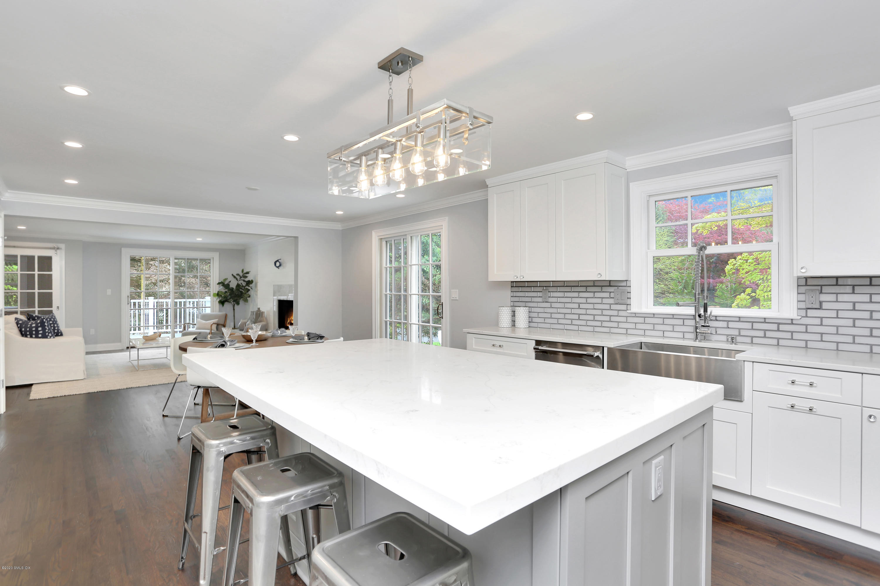 183 North Maple Avenue Greenwich, CT 06830 - Photo 5 of 26 a kitchen with stainless steel appliances a table and chairs in it