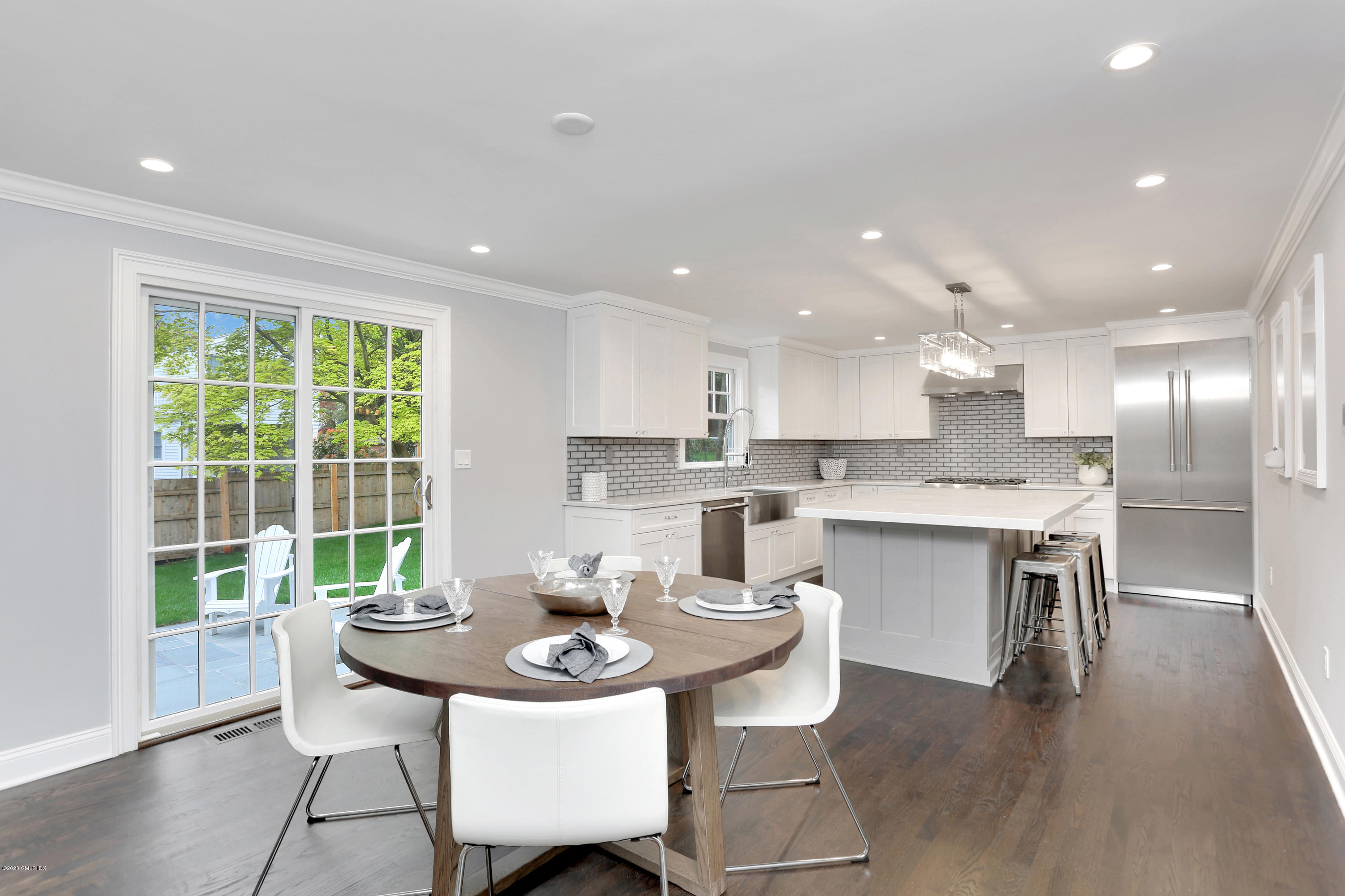 183 North Maple Avenue Greenwich, CT 06830 - Photo 7 of 26 a kitchen with a table and chairs in it