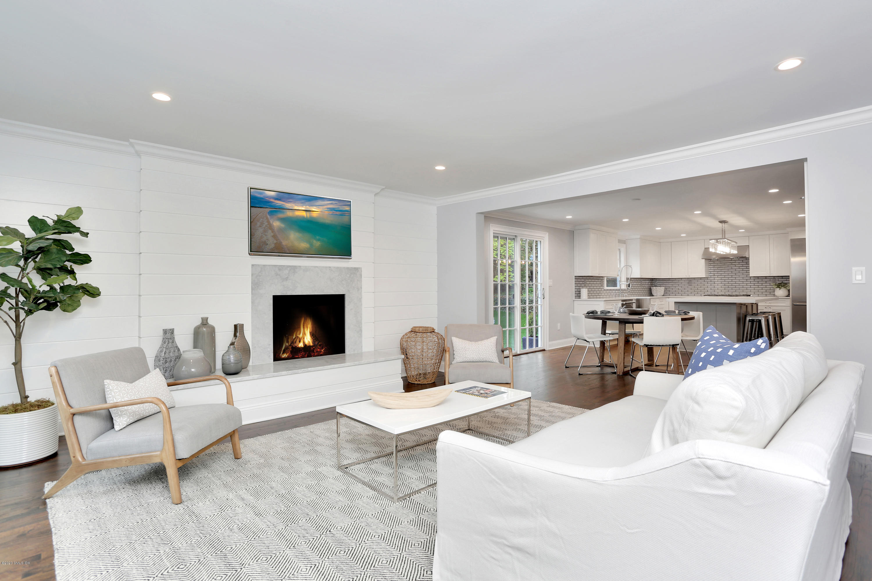 183 North Maple Avenue Greenwich, CT 06830 - Photo 9 of 26 a living room with furniture and a fireplace