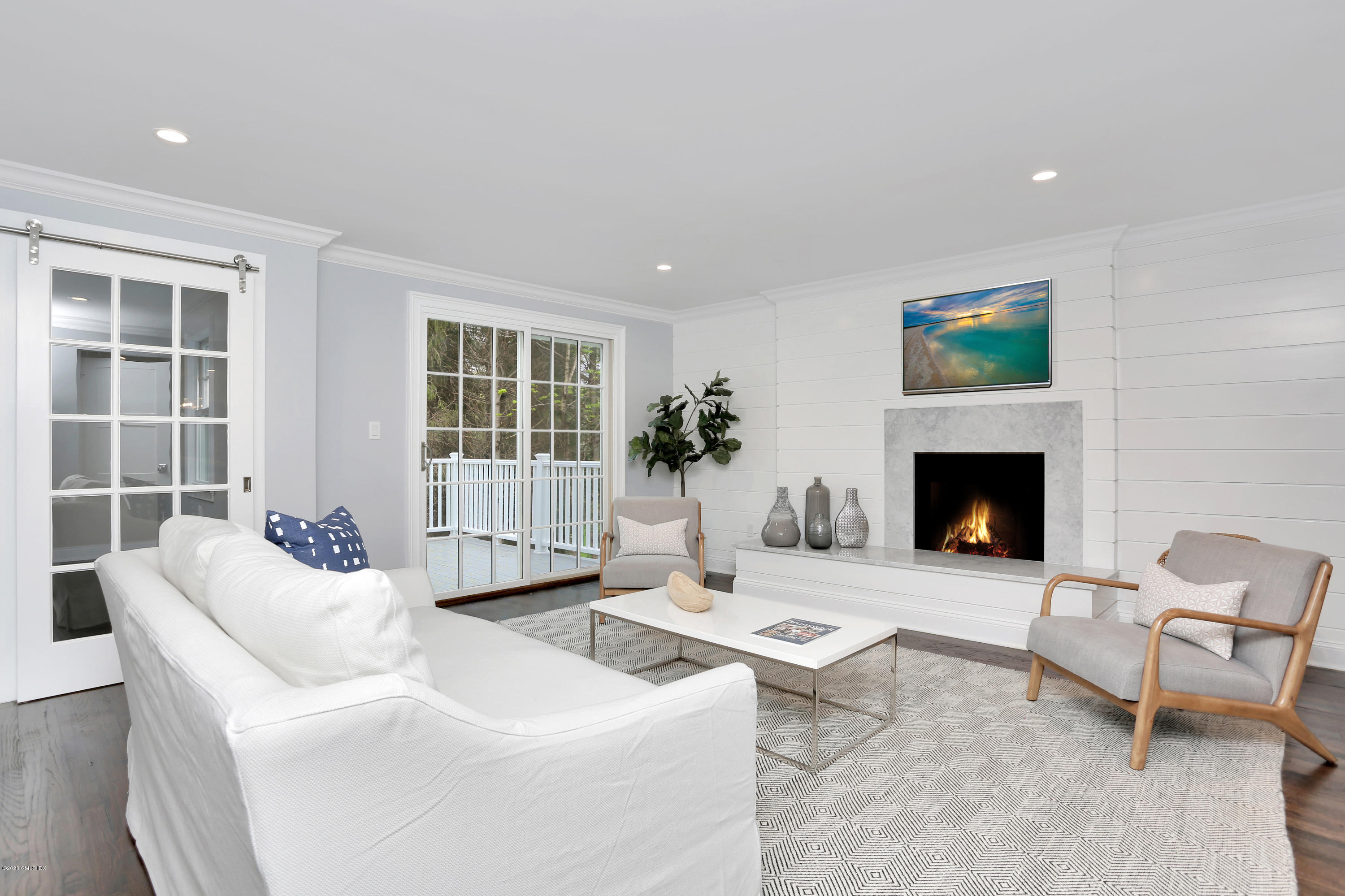 183 North Maple Avenue Greenwich, CT 06830 - Photo 10 of 26 a living room with furniture and a fireplace