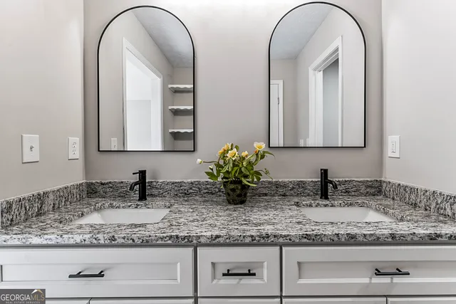 a bathroom with sink and mirror