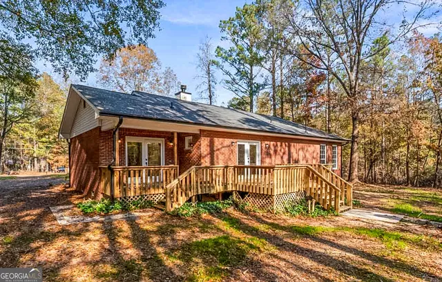 a view of a house with a iron fence