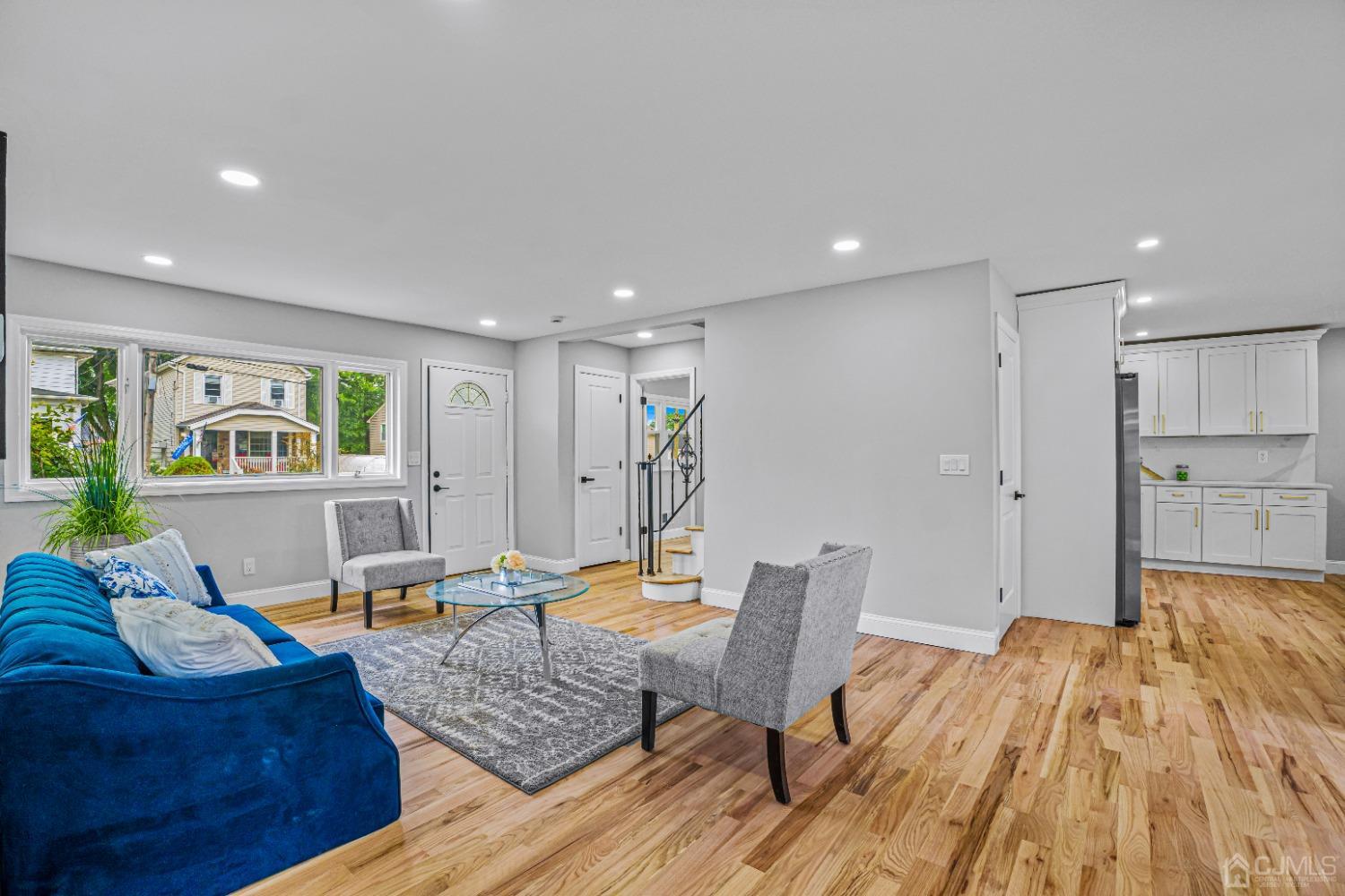 64 Enfield Road Colonia, NJ 07067 - Photo 3 of 40 a living room with furniture and wooden floor