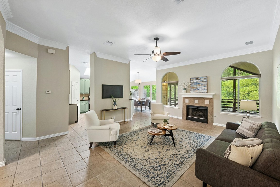 3510 Rip Ford Drive Austin, TX 78732 - Photo 1 of 1 a living room with furniture a fireplace and a chandelier