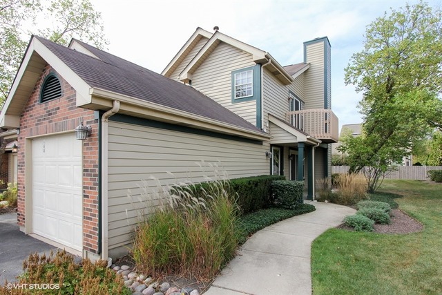 a view of a house with a yard and plants