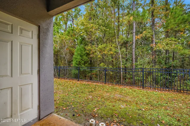 an aerial view of a house with outdoor space